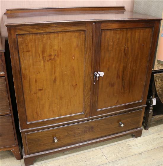 A mahogany linen press cupboard W.122cm